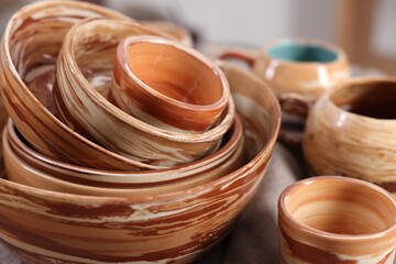 Different beautiful pottery on table indoors, closeup