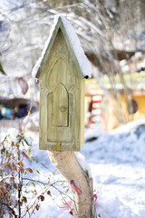 Small decorative house in a winter park