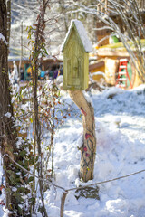 Small decorative house in a winter park