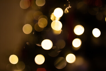 Fototapeta premium Abstract golden bokeh lights, perfect for festive backgrounds, websites, or holiday designs. Warm and inviting.