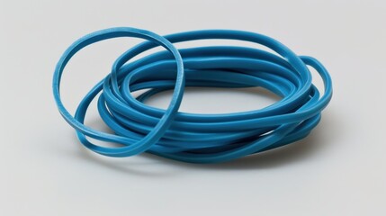 Fototapeta premium Rubber Band: A versatile, flexible rubber loop used for securing items, bundling supplies, or organizing objects in various home, office, or craft applications. 