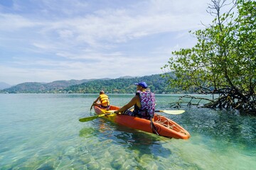 person kayaking in the sea