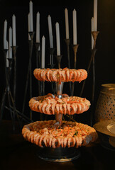 sea shell on a black background, shrimp cascade, shrimp, haute cuisine