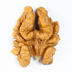 Macro peeled walnut, kernel, white isolate background, top view.