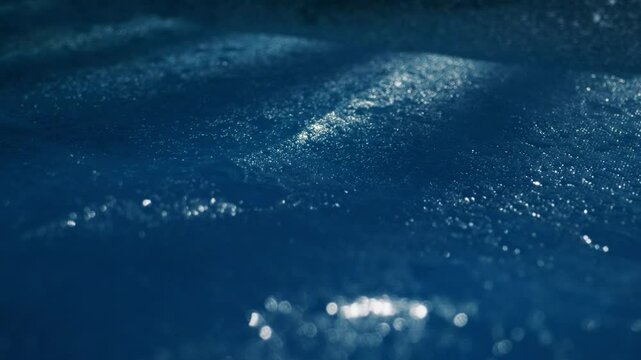 Tranquil Water Surface with Raindrops in Beautiful Blue Hues Captivating the Mind