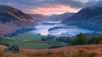 Obraz premium Misty sunrise over valley lake and mountains.