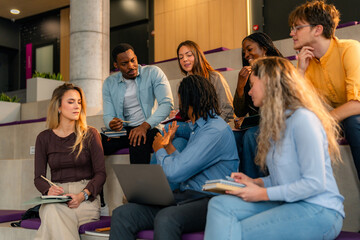 University students brainstorming and learning together with laptop and notebooks