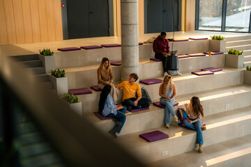 University students collaborating and studying in modern campus space