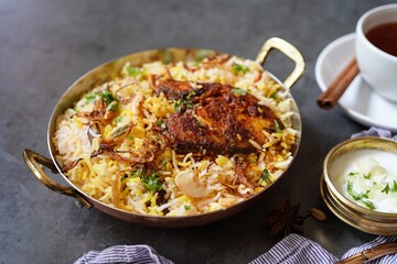 Homemade King fish biryani served with yogurt