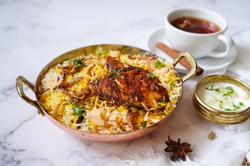 Homemade King fish biryani served with yogurt