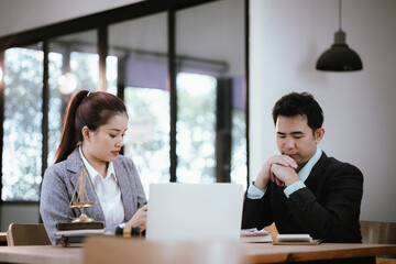 Lawyer Legal counsel presents to the client a signed contract with gavel and legal law. justice and lawyer Business partnership meeting concept.