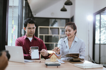 Real estate professionals meet with clients to discuss real estate investing, sales, and mortgage options. They review contracts to ensure a safe and successful transaction.