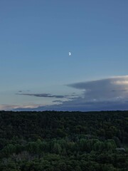 Moon over the mountains and forest