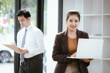 Two Asian businessmen in a modern office