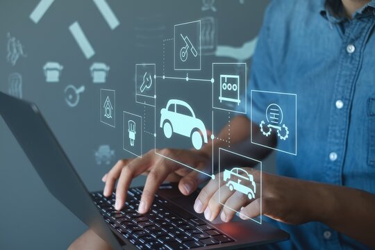 Person using laptop for online car maintenance services