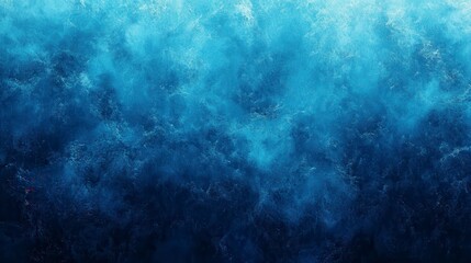 Fototapeta premium Abstract background with shades of blue, featuring a textured and speckled surface. The image evokes a sense of depth and movement with varying tones