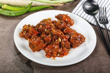 Manchurian chicken with sauce and spices