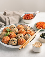 Korean Rice Balls (Jumeokbap) with kimchi and seaweed, selective focus