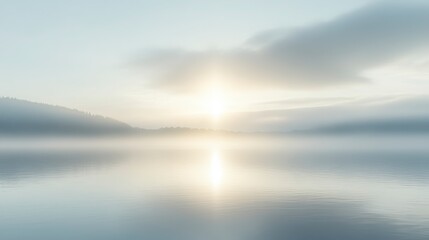 Obraz premium Soft, pale sunrise over a misty lake with scattered ice. Calm water reflects the warm light, creating a serene and peaceful atmosphere. Distant dark