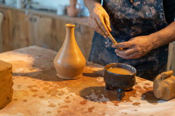 The joyful experience of creating Artisan Pottery in a warm and inviting studio atmosphere