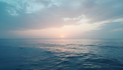 Obraz premium Tranquil Dawn Scene of Ocean and Cloudy Pastel Skies