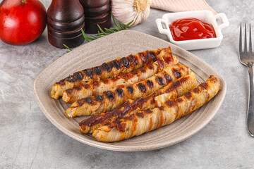 Grilled meat sausages wrapped bacon