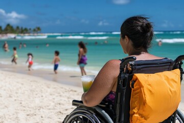 Naklejka premium A woman sitting in a wheelchair enjoys a colorful drink at the beach, surrounded by children playing in the water, showcasing joy, freedom, and the essence of summer.