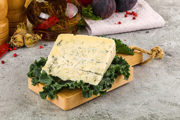 Blue cheese piece over board