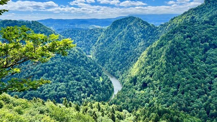 View of the mountains and the Dunajec River from above in Pieniny National Park, Poland. Seen from the trail between Mount Sokolica and Mount Trzy Korony. Perfect for travel, hiking and outdoor themes © Krystsina_Semianiuk