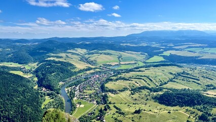 Panoramic view from Mount Trzy Korony to mountains, forests, and the Dunajec River in Pieniny National Park, Poland. Ideal for travel, hiking, and nature photography themes. © Krystsina_Semianiuk