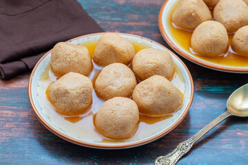 Delightful Nolen Gurer Rosogolla, A Sweet Bengali Tradition with Rich Flavors and Unique Date Palm Jaggery Essence
