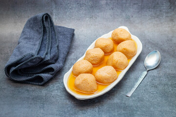 Nolen Gurer Rosogolla, A Sweet Bengali Delicacy Made with Date Palm Jaggery, Perfect for Festivities and Traditional Occasions