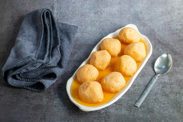 Delightful Nolen Gurer Rosogolla, The Rich, Aromatic Bengali Dessert Infused with Date Palm Jaggery, A Timeless Culinary Treasure