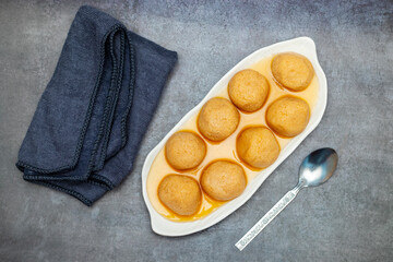 Delightful Nolen Gurer Rosogolla, A Sweet Bengali Tradition with Rich Flavors and Unique Date Palm Jaggery Essence