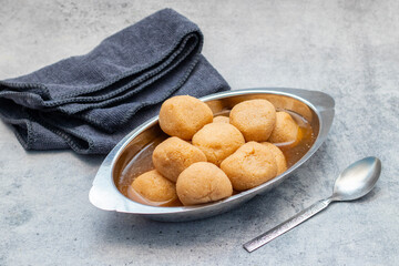 Delightful Nolen Gurer Rosogolla, The Rich, Aromatic Bengali Dessert Infused with Date Palm Jaggery, A Timeless Culinary Treasure