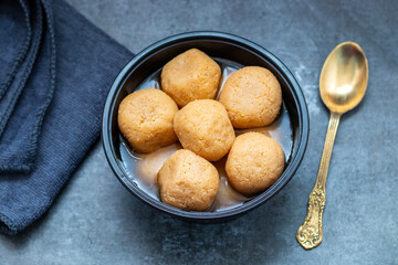 Delightful Nolen Gurer Rosogolla, The Rich, Aromatic Bengali Dessert Infused with Date Palm Jaggery, A Timeless Culinary Treasure