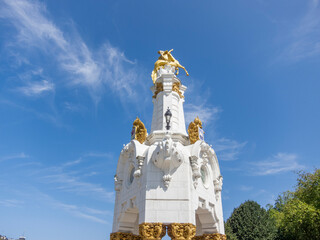 Naklejka premium Detail shot of the white and gold sculptures on the bridge of María Cristina in the tourist city of San Sebastián on a sunny day.