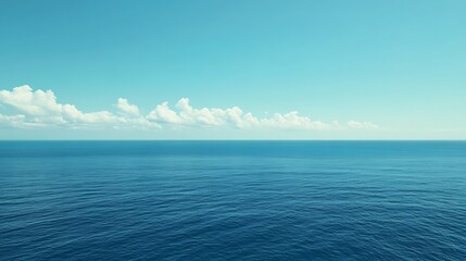 Fototapeta premium Serene Ocean Horizon Under a Calm Blue Sky