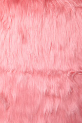 Close-up of soft pink fur with a fluffy texture and natural wave patterns. Perfect for fashion, upholstery, textiles, or creative background designs