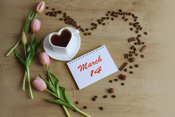 Calendar for March 14: name of the month March in English, numbers 14, cup of tea, tulips, heart made of coffee beans