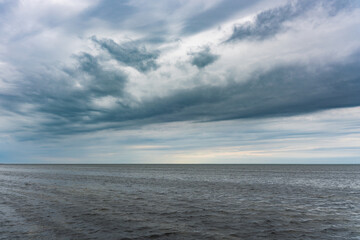 Dramatic stormy sky over the sea. Bad weather at the resort