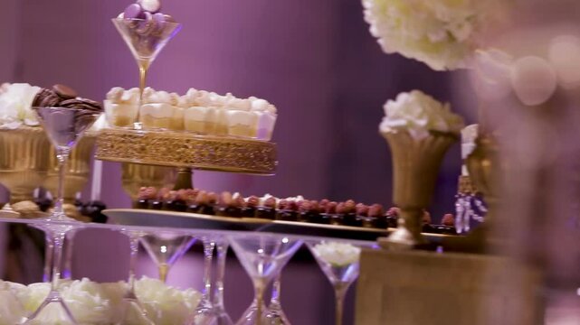 Elegant dessert display at a celebration in an upscale event venue
