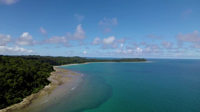 The islands of Andaman and Nicobar are tropical jewels, covered in lush rainforests, surrounded by turquoise waters, coral reefs, sandy beaches, and rich marine biodiversity.