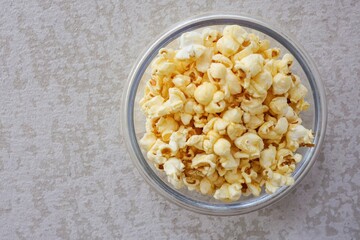 Popcorn in a clear bowl , top view 