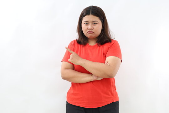 Moody upset whining woman unhappy pointing right, sulking look miserable and distressed, express regret and disappointment, complain bad fortune, stand white background displeased