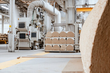 pulp processing machinery in operation, factory environment