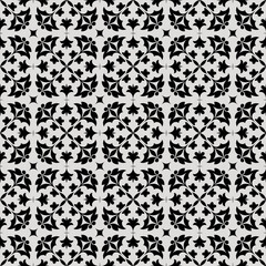 Dark Black and White Tile Pattern with Decorative Symmetrical Arrangements