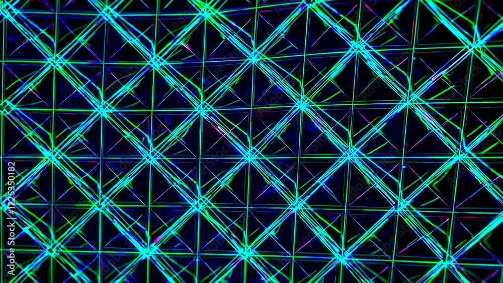 Poster dynamic light patterns displayed on a grid at a nighttime event in an urban setting