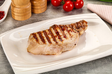 Grilled pork loin steak with bone