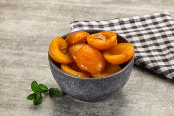 Sweet canned apricots with syrope